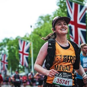 A woman wearing a Born Free running vest taking part in the London Marathon