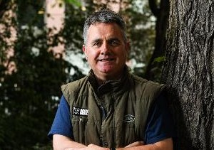 A headshot of Dominic Dyer