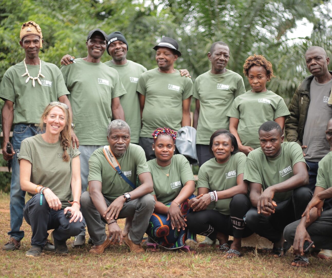 A group of Great Ape Guardians wearing green Born Free T-shirts, standing together
