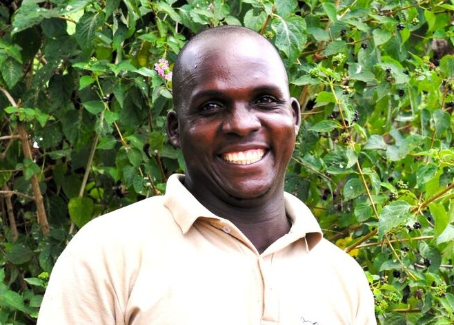 A headshot of Hassan Muriithi