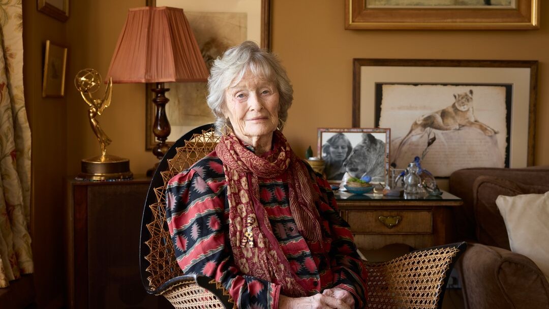 A portrait of Virginia McKenna at home with Born Free memorabilia